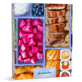 Boardwalk Puzzle Company's Bento Box | 500 Piece Jigsaw Puzzle features a limited edition illustrated bento box with sushi, grilled meat, dragon fruit, blueberries, rice, and assorted vegetables.