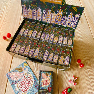 The Penny Puzzle Christmas Vibes Advent Calendar includes 24 holiday-themed 99-piece jigsaw puzzles in illustrated numbered boxes—perfect for a festive countdown to Christmas.