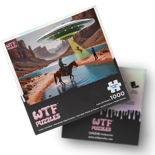 The Horsing Around 1,000 piece jigsaw puzzle by WTF Puzzles features a UFO beaming up a person as a cowboy on horseback looks on in a desert landscape with mountains and water. Includes poster.