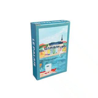 Housed in a rectangular blue box featuring an illustrated seaside town scene on the front and “LE PALAIS” on the side, the Trevell Le Palais | 99 Piece Jigsaw Puzzle is a delightful mini puzzle perfect for capturing the charm of Belle-Île-en-Mer.