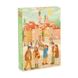 The Olleo Puzzles Golden City 1,000 Piece Jigsaw Puzzle features Yael Hofri’s art of a lively city square with colorful historic buildings. Finished puzzle size is 26.8" x 18.9".