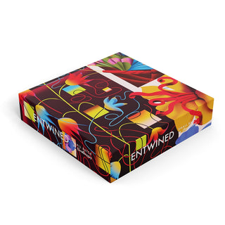 Cloudberries’ Entwined | 1,000 Piece Jigsaw Puzzle comes in a square box with a vibrant, abstract design of intertwining shapes and bold florals, reflecting the premium puzzling experience inside.