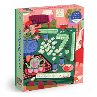 Mahjong Social | 1,000 Piece Jigsaw Puzzle by Galison showcases a vibrant illustration by Paige Jung, depicting a Mahjong game in progress on a green table surrounded by tea cups, a teapot, flowers, and colorful decor. This puzzle beautifully captures the lively atmosphere and intricate details of the scene.