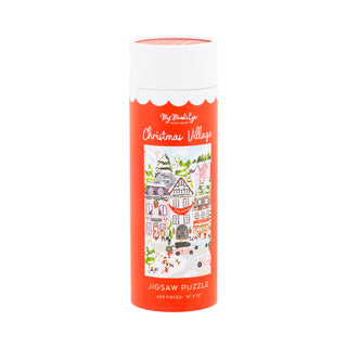 A cylindrical container with a red label features an illustration of "Christmas Village," a 500 piece jigsaw puzzle by My Mind's Eye—a festive holiday puzzle perfect for cozy winter nights.