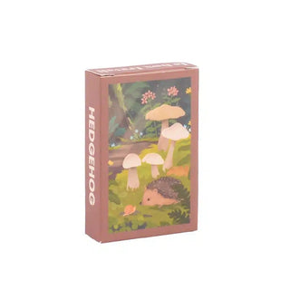 A brown box labeled Hedgehog | 99 Piece Jigsaw Puzzle from Trevell displays a hedgehog among grass, mushrooms, and plants—perfect for illustrated jigsaw enthusiasts.