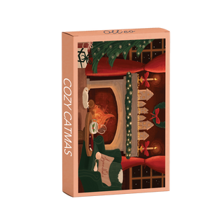 The Cozy Catmas | 99 Piece Jigsaw Puzzle by Olleo Puzzles comes in a rectangular box featuring festive cat artwork and includes a completed 99-piece puzzle illustrated by Charlène Girodet.