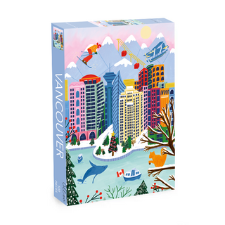 The Vancouver | 500 Piece Jigsaw Puzzle by Olleo Puzzles showcases vibrant city buildings, snowy mountains, cable cars, a harbor, and local wildlife. Designed by Sarah Kamil. Includes a reusable cotton storage bag.
