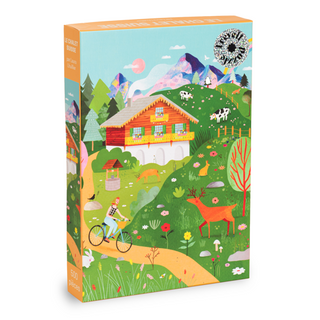 Introducing Trevell’s [Limited Edition] The Swiss Chalet | 500 Piece Jigsaw Puzzle—a vibrant, collectible puzzle illustrated by Laura Lhuillier. This design showcases a charming chalet nestled in a scenic mountain landscape, accented with details like a cyclist, deer, cows, and colorful flowers dotting the hillsides. The 500 piece count is displayed in the lower left corner of the box.