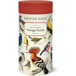 The Cavallini & Co. British Birds | 1,000 Piece Jigsaw Puzzle comes in a cylindrical container with a red lid and handy muslin bag, featuring beautiful illustrations of various British birds.
