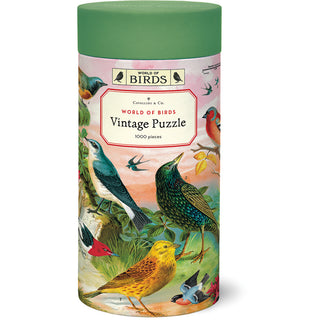 The World of Birds | 1,000 Piece Jigsaw Puzzle by Cavallini & Co. comes in a cylindrical box and features vintage-style illustrations of colorful birds for a charming and nostalgic puzzling experience.