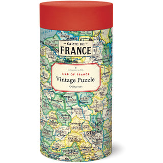 The Cavallini & Co. Map of France | 1,000 Piece Jigsaw Puzzle comes in a cylindrical tube featuring a colorful vintage map of France on the packaging.