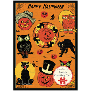 Celebrate spooky season with the Cavallini & Co. Vintage Halloween | 60 Piece Greeting Card Jigsaw Puzzle! This illustrated puzzle card features pumpkins, black cats, owls, bats, and spiders on an orange background, complete with “Happy Halloween” text at the top and a “Puzzle Greeting Card” label. With 60 unique pieces, this vintage-style greeting card puzzle is the perfect way to share Halloween fun with friends and family.