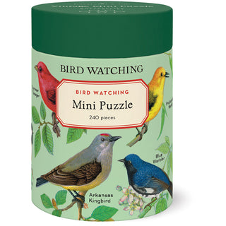 A cylindrical box from Cavallini & Co., labeled “Bird Watching | 240 Piece Jigsaw Puzzle,” is adorned with illustrated birds such as a Blue Warbler and Arkansas Kingbird, featuring imagery from the Cavallini archives. The puzzle comes with a biodegradable bag, and the finished size measures 10.5" x 14".