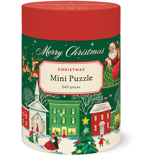 The Cavallini & Co. Christmas 240 Piece Jigsaw Puzzle comes in a festive cylindrical container, includes a biodegradable bag, and assembles to a delightful 10.5" x 14" snowy village holiday scene.