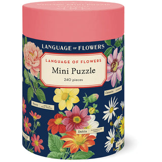 The Cavallini & Co. Language of Flowers | 240 Piece Jigsaw Puzzle comes in a cylindrical box with vibrant floral artwork from the Cavallini archives on navy blue and includes a biodegradable storage bag.