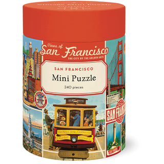 A cylindrical container labeled "San Francisco | 240 Piece Jigsaw Puzzle" by Cavallini & Co. features archive illustrations of San Francisco landmarks and a cable car; finished puzzle size is 10.5" x 14".