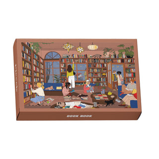 Illustration of a cozy library with readers, plants, lamps, and a cat. The Piecely Book Nook | 99 Piece Jigsaw Puzzle is made from recycled cardboard and comes in plastic-free packaging.